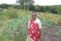 Mama Nesierus trench garden. Look at how proud and hopeful is the smile on her face.